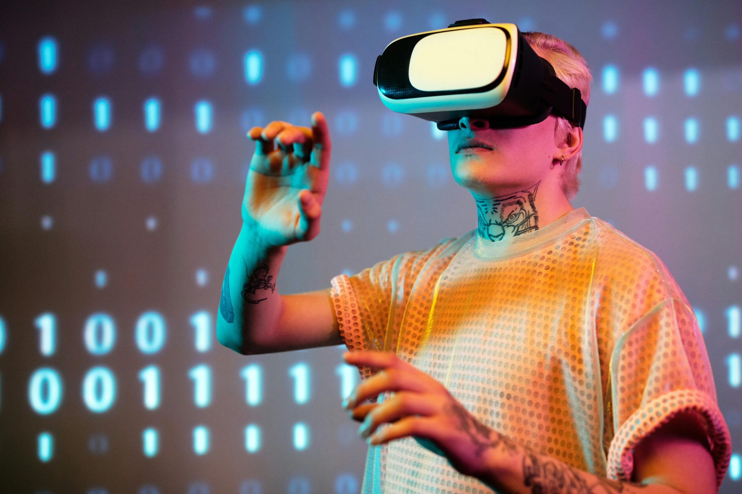 A young man interacts in virtual reality wearing a headset with a digital binary background.